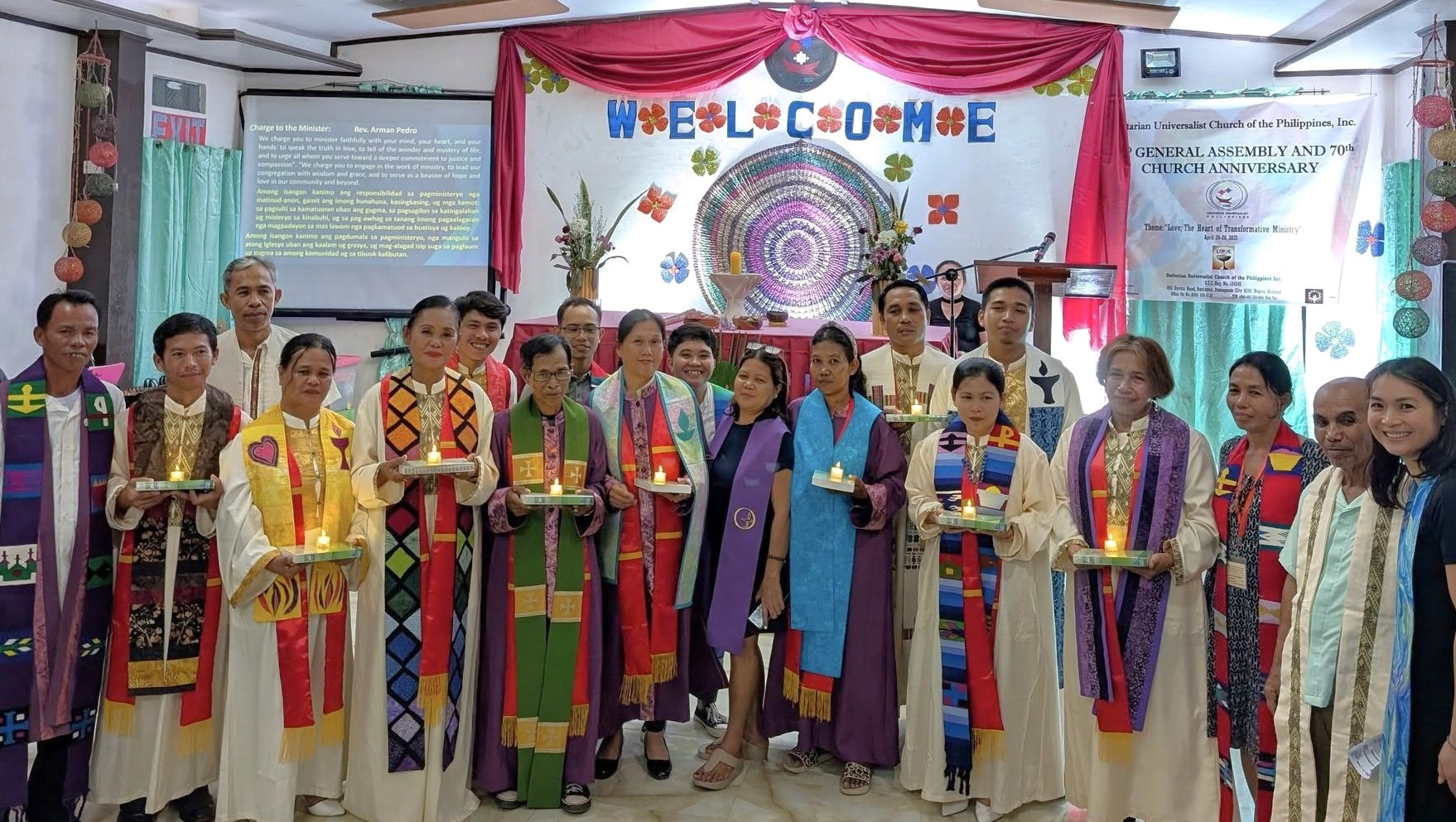 UU Church of the Philippines 70th Anniversary and General Assembly 2 - group of people in ceremonial dress in front of a banner