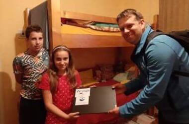 Girl receiving the laptop